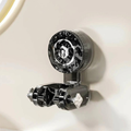 Close-up of a shower head with measurement markings on a white background